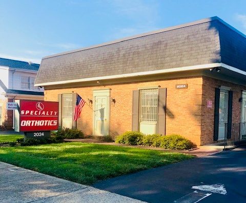 Specialty Orthotics office building with American flag